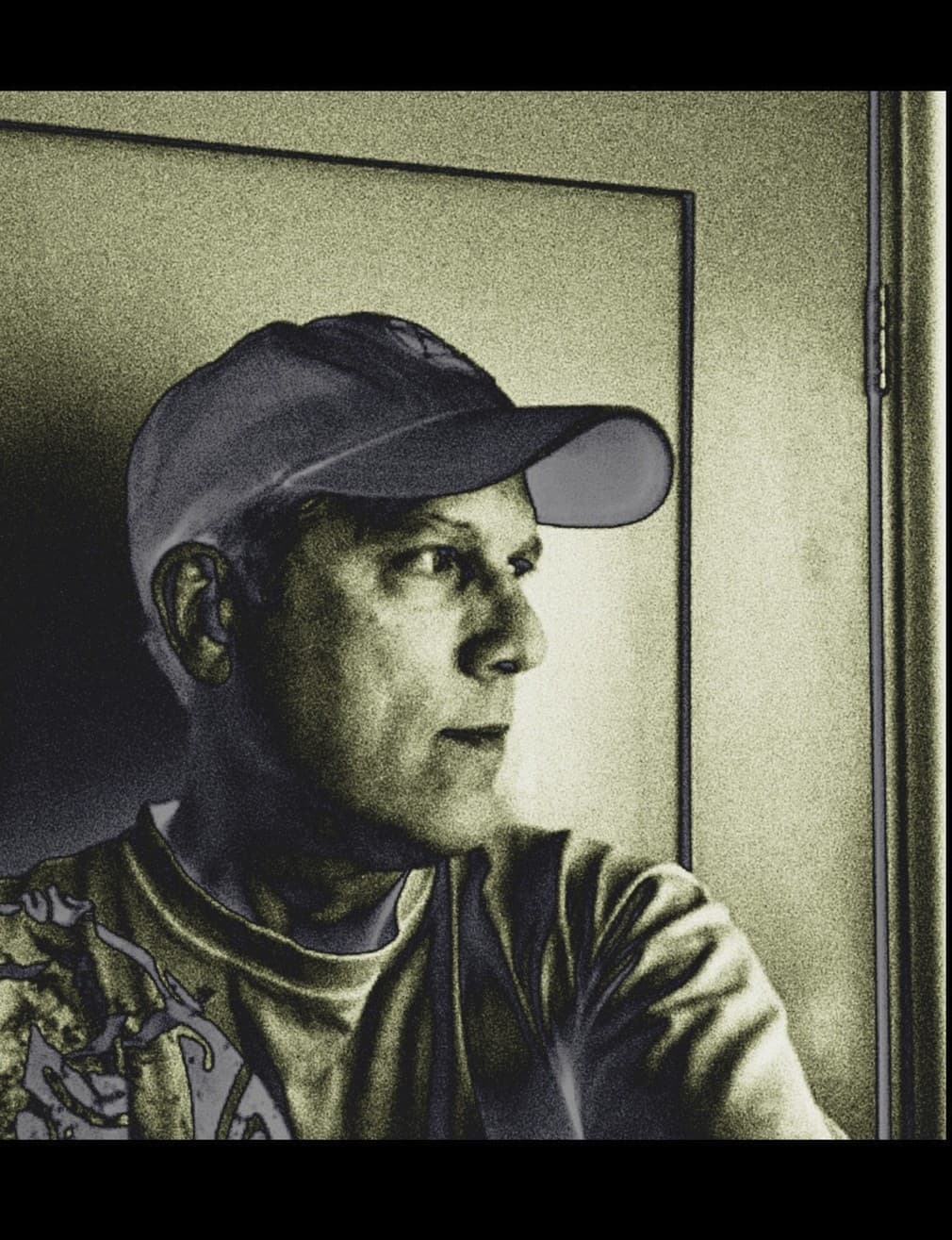 Portrait of an artist in a cap by a window
